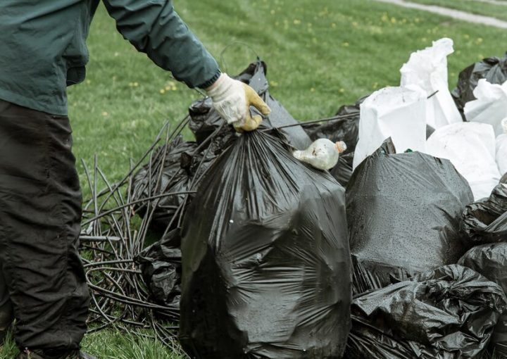 Bin bags filled with mixed waste, including non-recyclable items such as plastic bags, food packaging, and other contaminants, which disrupt proper recycling processes